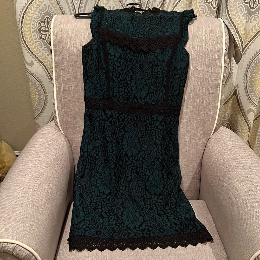 Lace dress with floral lace pattern with black embellishments